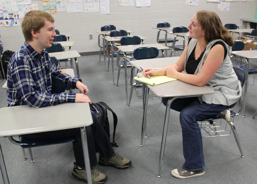 Mrs. Clark, English,  reviews her notes taken during the Best Buddies interviews.  Students interested in Best Buddies are interviewed to be paired with a West Lake student. 