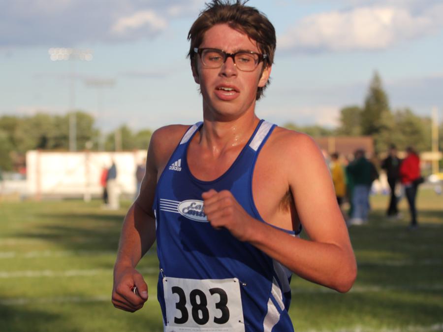 Chris Albright (12) finishes the grueling meet on Tuesday, Sept.  18. Albright ran his heart out despite the cold weather. 
