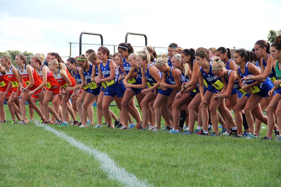 The Lady Indians position themselves before the shot goes off to start the race.  The cloudy sky and the cool air was perfect weather for running, and the girls took advantage of it.
