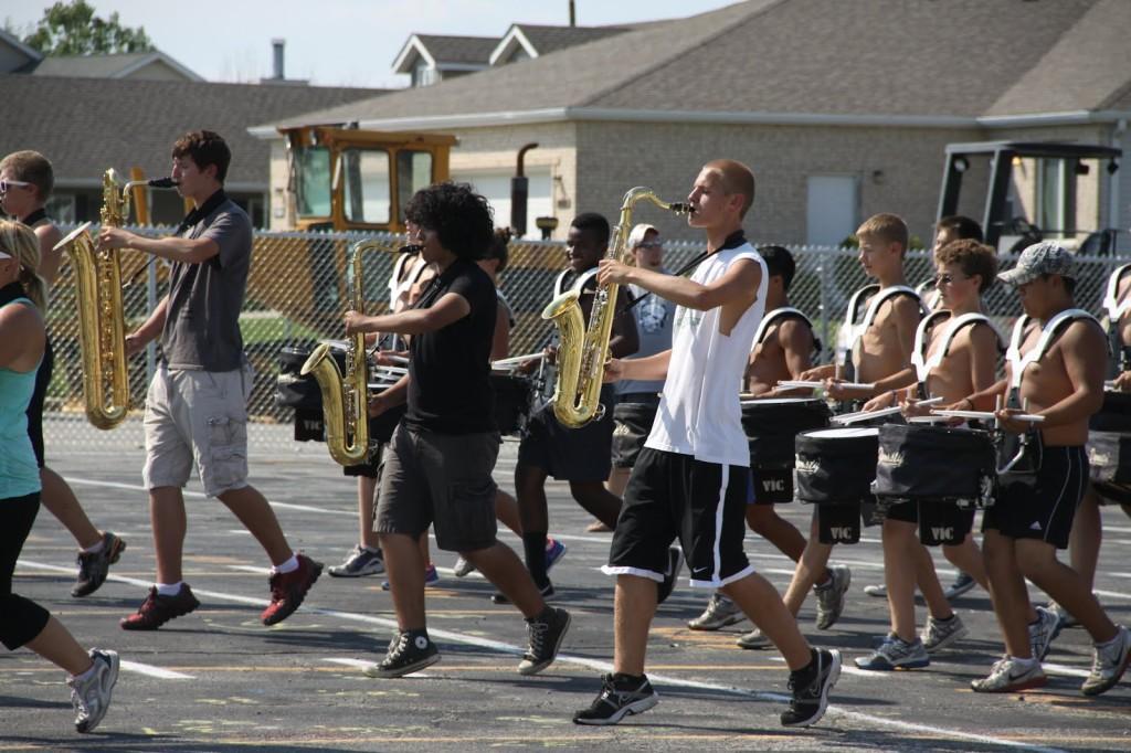 Andres+Ramirez+%2810%29+plays+the+saxophone+during+a+Tuesday+afternoon+practice.+Marching+band+kids+practiced+three+hours+a+day+besides+Tuesdays.