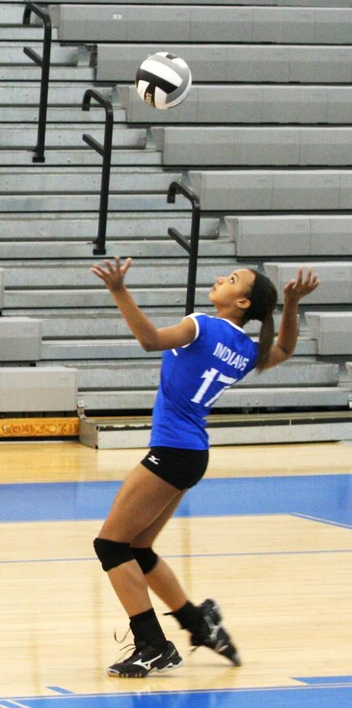 Alyssa Stepney (10) sets up for a serve over the net to Valparaiso. The girls won the last match of the season against the Valparaiso Vikings in the LC gymnasium, bringing their final record 21-0.