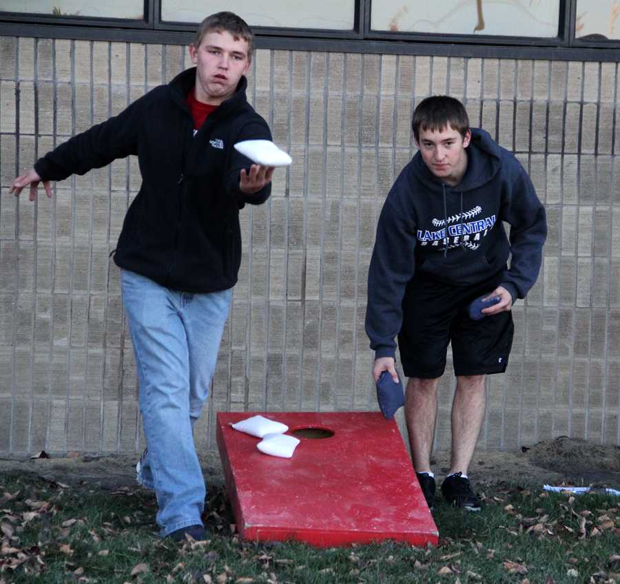 Ryan Polito (11) and Charles Alexa (11) practice before the beanbag tournament. The tournament was sponsored by the wrestling team. 