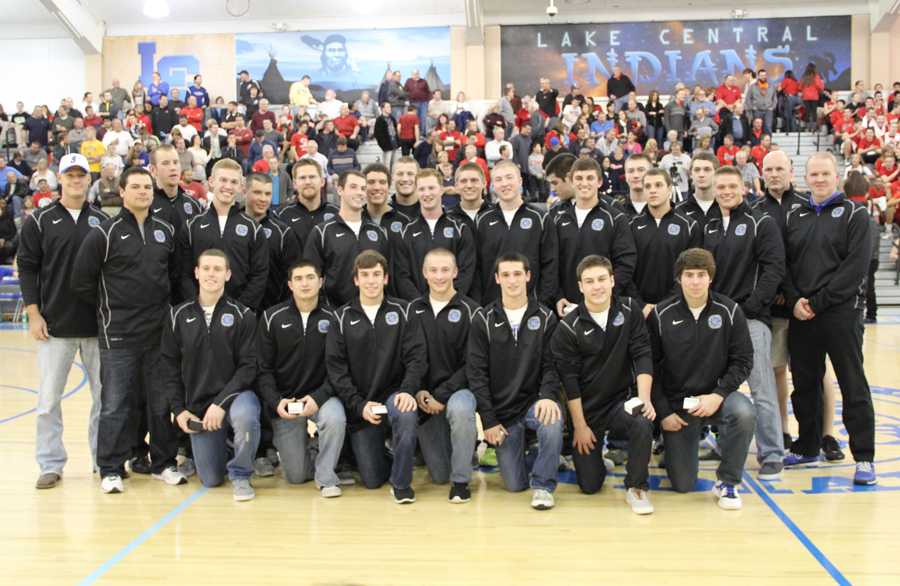 The 2012 varsity boys baseball team poses for a photo for family and fans after receiving their championship rings at the Dec. 18 basketball game against Munster. The new rings brought bragging rights for LC fans to chant about to the Munster fans--the team LC beat in the first round of Sectionals. 

