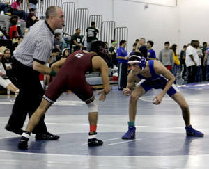 David Otano stands ready to face his opponent.  Otano wrestled in the 106-pound weight class at the Harvest Classic.