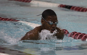 Jamiere Wilson (10) swims the breaststroke at the Crown Point meet on Jan. 15, 2013.  Wilson finished fourth in the event with a time of 1:09.15.  