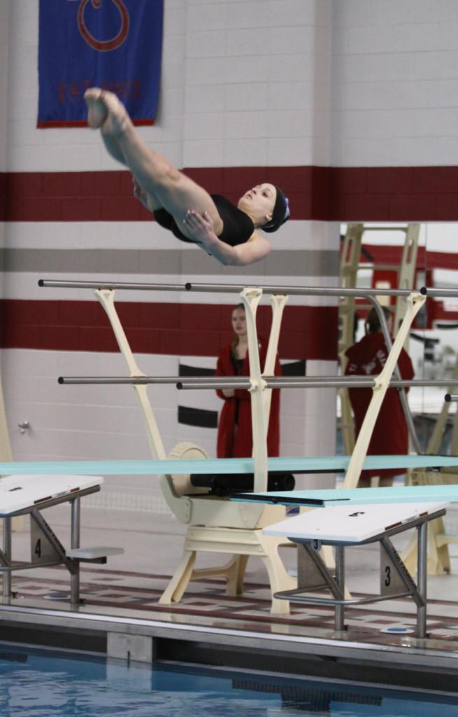 Abigail Prince (11) is in the middle of one her first dives at Sectionals.  Prince received third place, qualifying for Regionals.