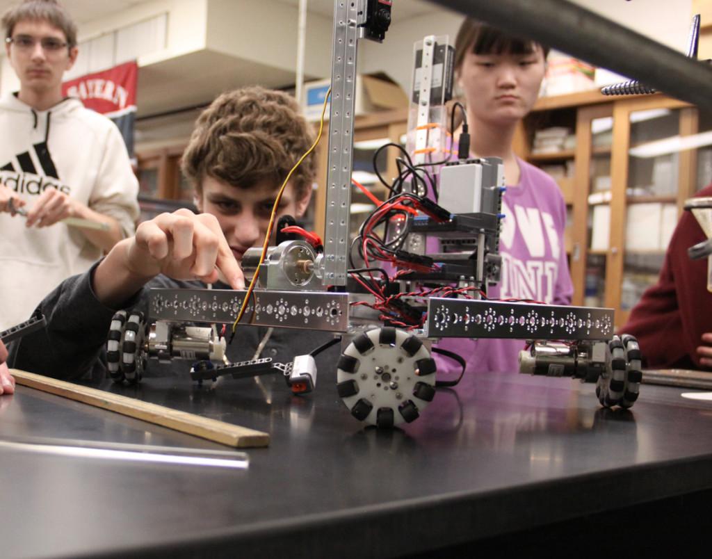Brandon Haddon(9) works on the team’s robot. The Robotics Club goes to competition this Saturday. 