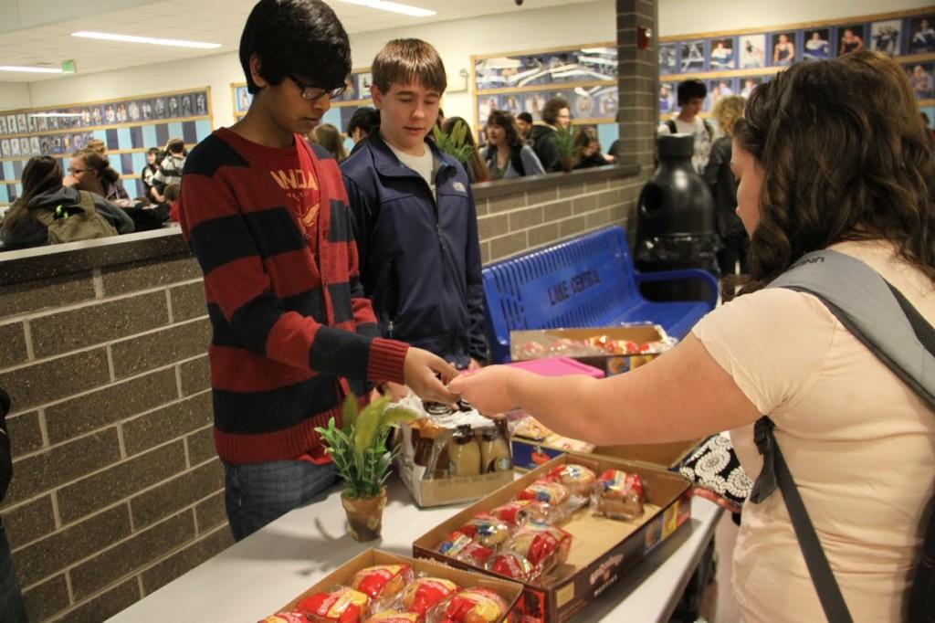 Surya Vezhavendan(10) and Andrew Pharazyn(11) sell breakfast items on Mar. 22 to raise money for Business Professionals of America.  BPA is going to Nationals in Florida to compete for scholarships.  