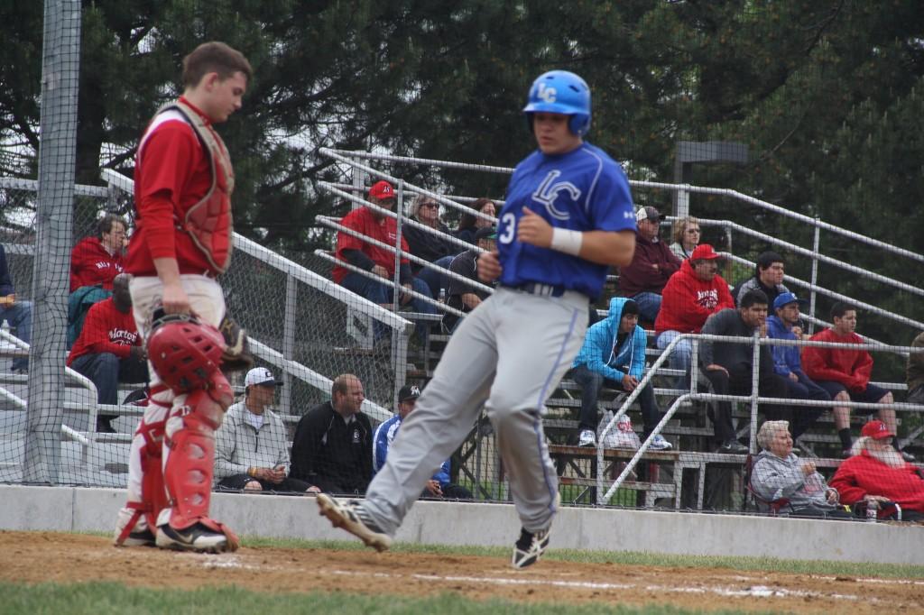 Antonio Majstorov (12) crosses home plate against the Morton Governors on Monday, May 27. The Tribe took the 12-2 W in the Sectional semifinal.