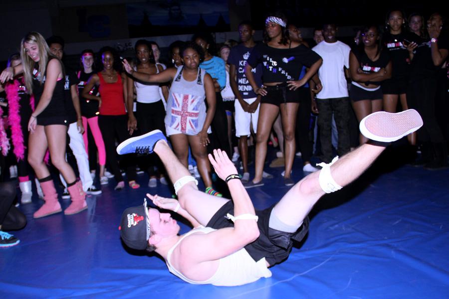 Matthew Lambertino (12) break dances at the Homecoming dance. The dance took place on Friday Sept. 27 after the game. 