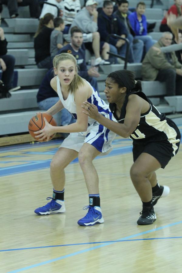 Rachel+Bell+%2810%29+looks+for+a+teammate+to+pass+the+ball+to.++Bell+scored+three+baskets+at+the+game+on+Nov.+23