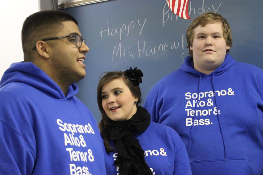 Justin Cortez (11), Caroline Janiga (12) and Charles Lobaugh (12) prepare to sing their final carol in Mrs. Stephanie Harnew’s, Science, classroom. Counterpoints went caroling on Dec. 12, and gave a special performance for Mrs. Harnew’s class at her request for her birthday.