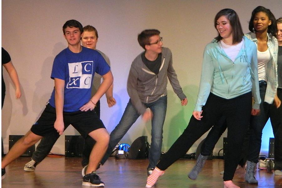 Brett Balicki (10), Lauren Bourget (12), Jackson DeLisle(10), Adam Gustus (9) and Kendra Williams (11) practice a dance for the musical during the first dance rehearsal in the auditorium. After going through the steps a few time, they began to get the hang of the dance