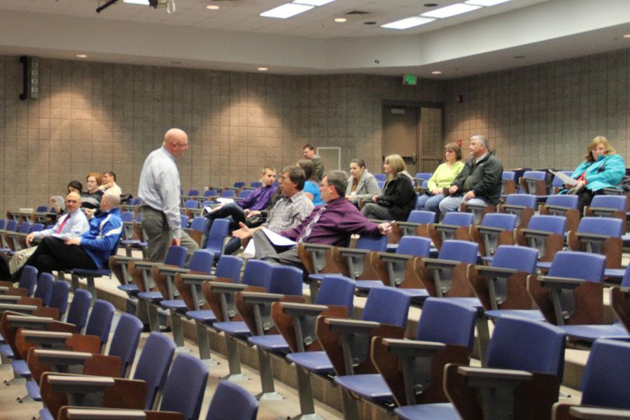 Faculty prepares to conduct the board meeting. Approximately 20 parents came to hear discussion of several different issues that affect their children.