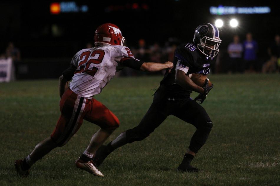 Antwan Davis (12) escapes a Munster defender’s grasp. Davis caught nine passes for 95 yards during the LC-Munster square-off on Friday, August 22.
Photo by: Cassidy Niewiadomski