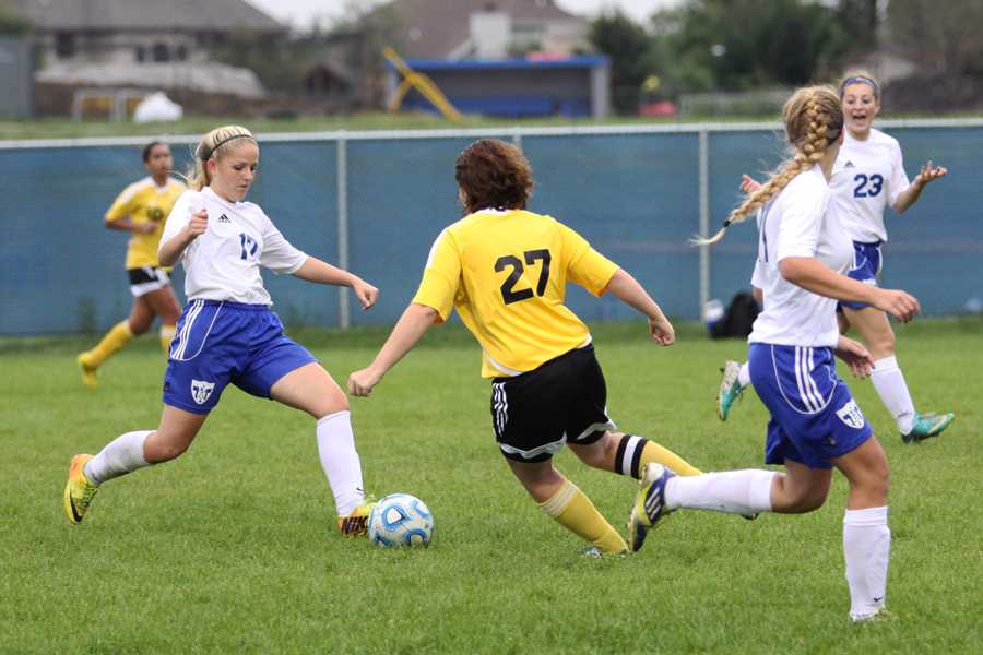 Madison Sarkey (9) passes the ball to a teammate.  This is Sarkey’s first year playing for Lake Central.