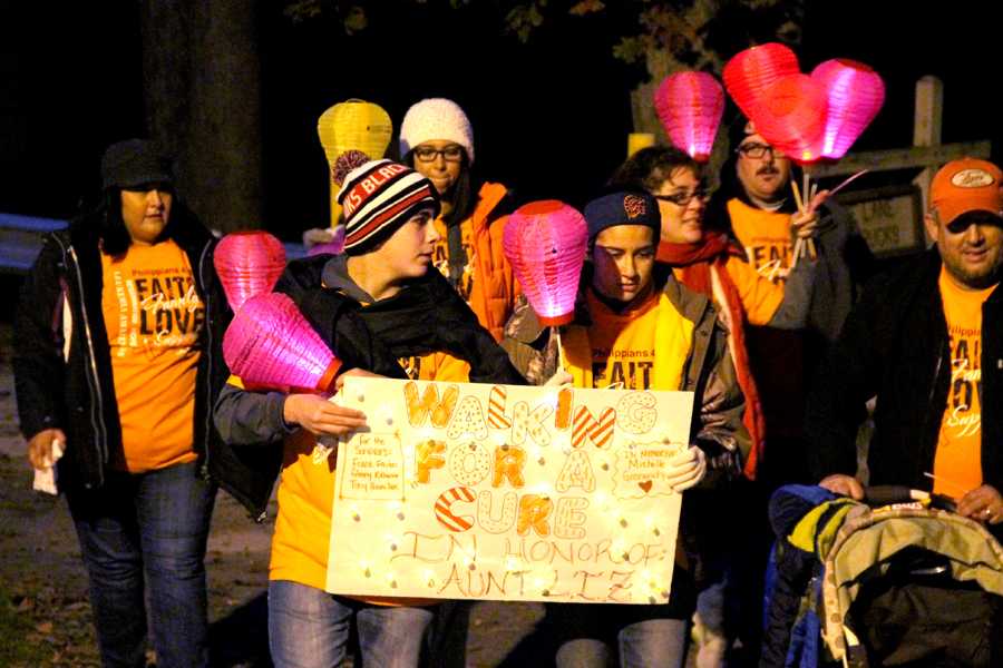 Members from Walk for A Cure finish the Light the Night Walk, which was hosted by the Leukemia and Lymphoma Society at the Lake County Fairgrounds on Saturday, Oct. 18. During the walk, gold lanterns were held in remembrance of those who have passed, white lanterns were held by survivors and red lanterns were held by supporters. 