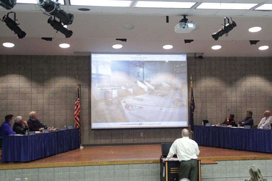 Mr. Bill Ledyard, Director of Facilities, shows the school board members photos of Phase Three of construction. The meeting was held on Nov. 17 in the LGI. 