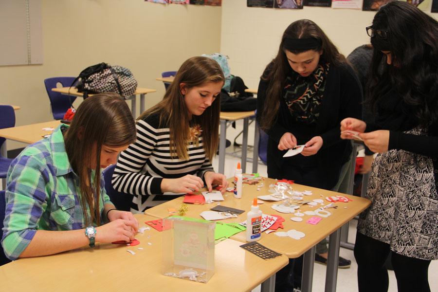 French club members participate in making snowmen ornaments. There were 4 different crafts the students could put together.
