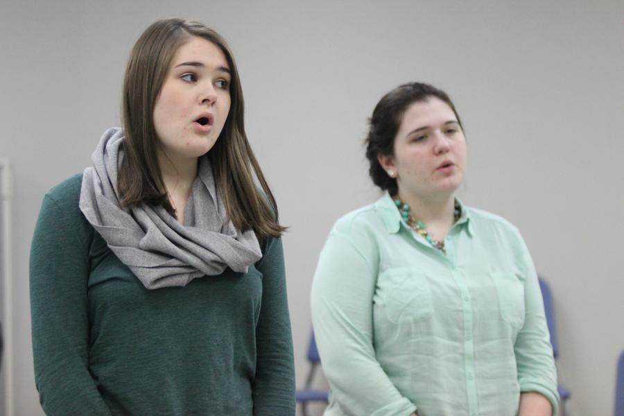 Megan Barry (11) and Tabitha Prowse (12) warm up at the beginning of practice. The thespians warmed up by doing scales and tongue twisters. 