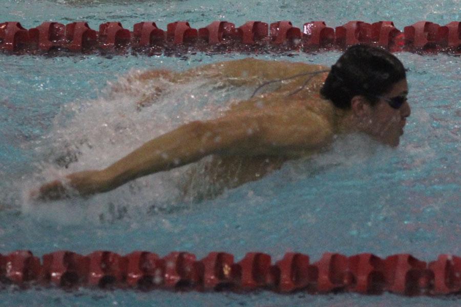 Joshua Barajas (12) does the butterfly in the 200 IM. Barajas placed second in this event. 