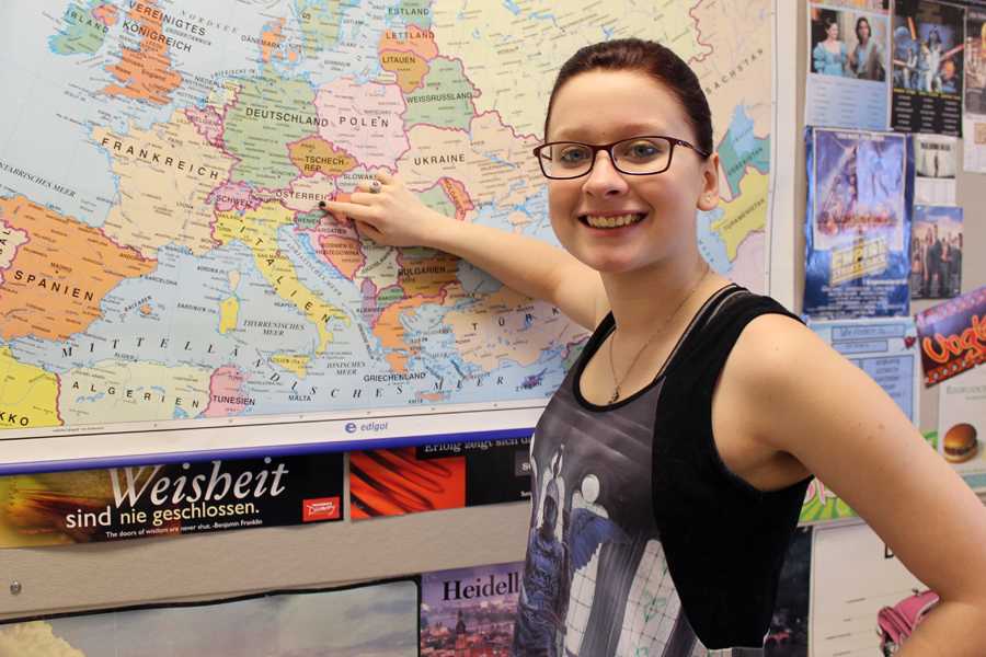 Emily Hansen (11) points to the city in Austria where she will be traveling to. Hansen had to leave all of her communication devices at home in order to go on her journey. 
