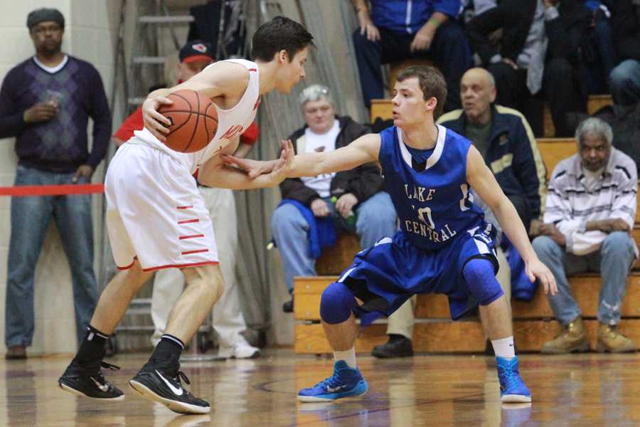 Gage Ray (11) guards Andrew Hackett (12) of Munster.  Ray’s defense helped calm the Mustang’s outside shooting. 
