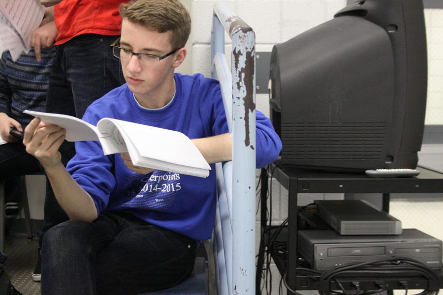Adam Gustas (10) reads over his lines at the first rehearsal of Forbidden Broadway. This was Gustas’s third show this year, and he played three different roles.  Photo by: Cathryn Cearing