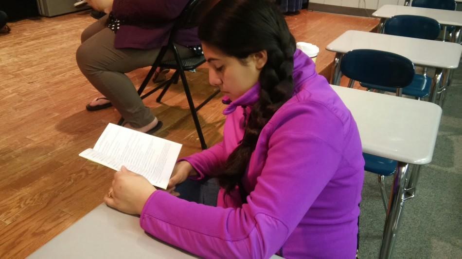 Miranda Munoz (8) reads her script at the first rehearsal. During the rehearsal, most of the time was spent reading through scripts and getting to know each other.  