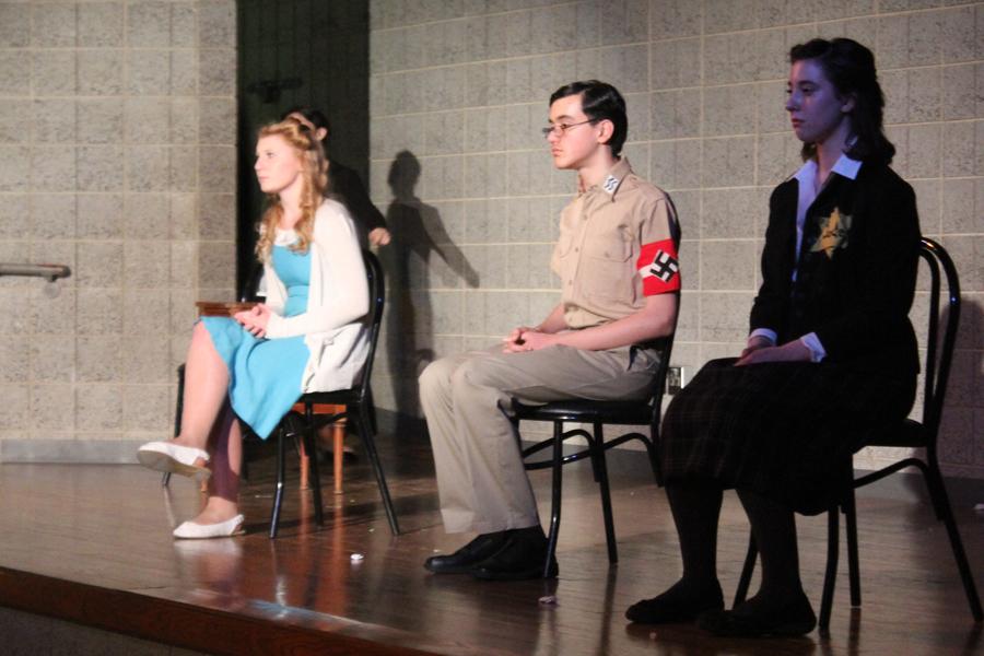 Claire Kijewski (9), Timothy Bakas (9), and Alexa Spasevski (9) sit as they express their inner feelings towards the events of World War II. The characters each gave a different insight into those affected by the war.
