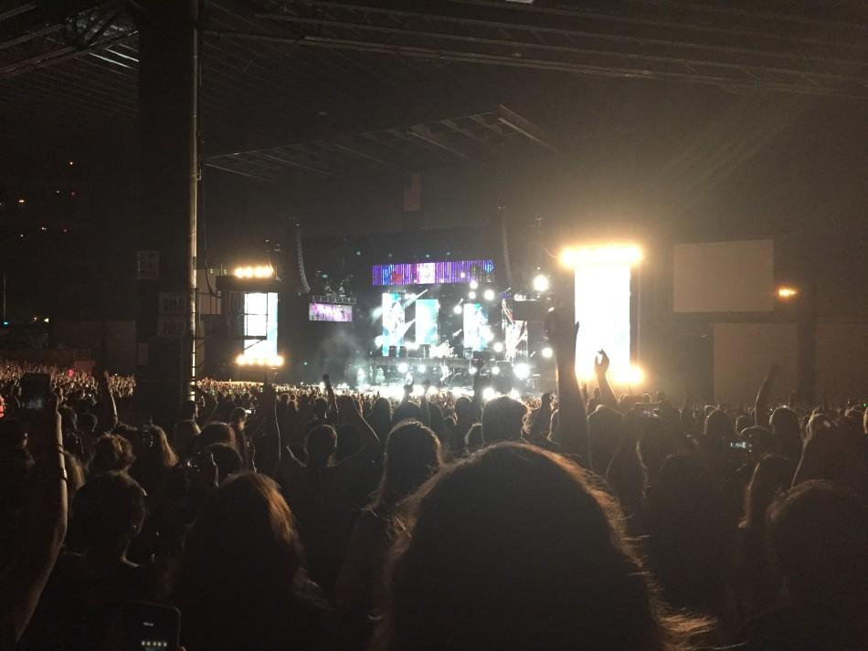 Fan’s hands are up in the air as the band performs an upbeat song. The concert lasted about two hours long.