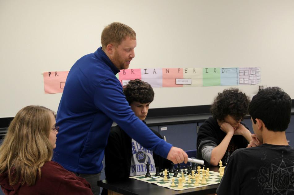 Dr. Dustin Verpooten, Science, explains different tactics to the students so they can them use while facing an opponent. Dr. Verpooten is the sponsor of the Chess club.