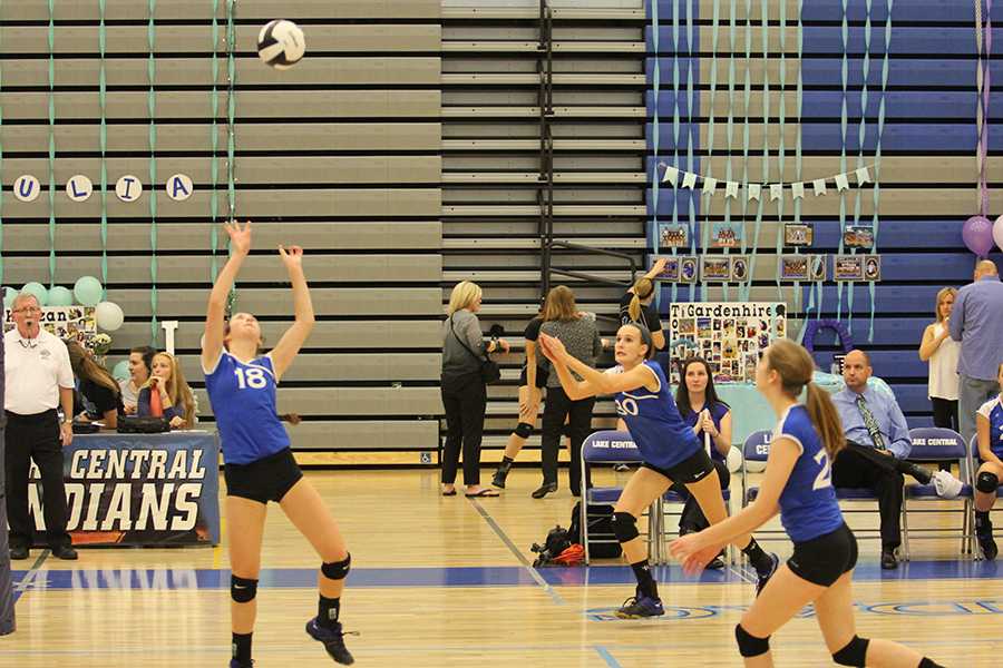 Mia DiNino (10) gets ready to set the ball. Nicole Dubish (10) and Kaylee Marovich (10) dove after the ball to volley it over the net.