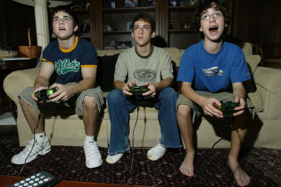 Three friends spend a night hanging out and playing video games. There is no reason to feel obligated to spend a fall Friday night at a football game. Photo provided by: mctcampus.com
