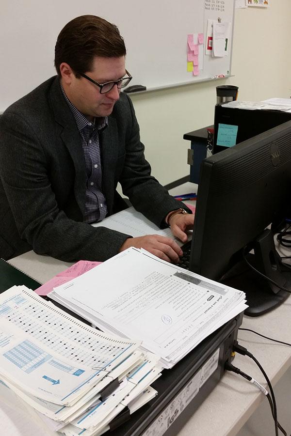 Mr. Joseph Weil, World Language, works on putting grades into the computer. Prior to teaching at LC,  Mr. Weil spent six years in the military.