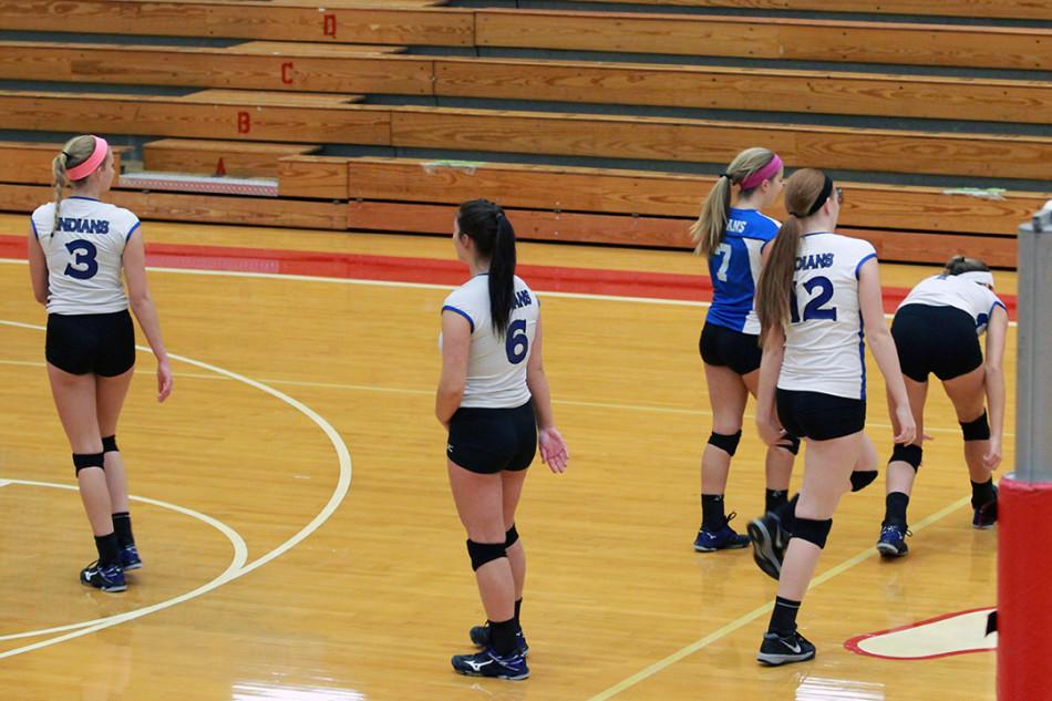 Samantha Anderson (12), Stephanie Spigolon (12), Mackenzie Evers (12), Julia Kruzan (12) and Victoria Gardenhire (12) congratulate each other  after the point. The group of seniors returned to their spots to continue to match.