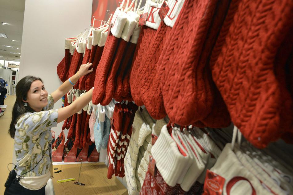 Megan Shoemaker of Fairless Hills, Pa., works on a Christmas stocking display at Kohls in Yardley, Pa., on Friday, Oct. 2, 2015. Kohls plans to add 69,000 seasonal jobs, with hiring to start this month, to ensure an easy shopping experience and great service during the busy holiday shopping season. Photo by: William Thomas Cain/Philadelphia Inquirer/TNS (Used with limited license)