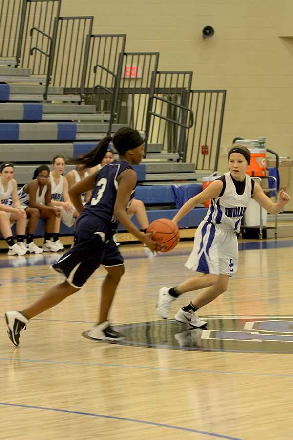 Jaidyn Brown (9) defends against the opponent bringing the ball up the court. The Indians played Michigan City at home.