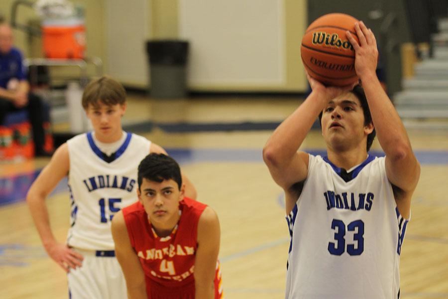 Justin Graciano (10) shoots a freethrow to even out the score before halftime. The game took place at home. 
