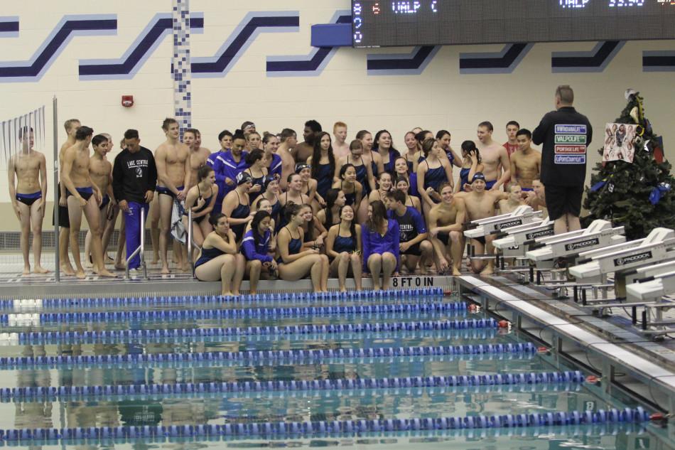 Both the boys and girls swim teams pose for a picture. The overall score at the JV boys meet was 109-76.