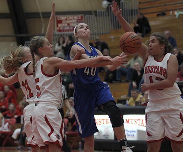 Kylie Fehrman (11) drives to the hoop. Fehrman has been a key player for the Lady Indians this season.