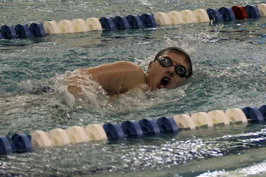 Aaron Schassburger (10) turns around to complete another lap of the 200 IM.  Schassburger came in third place in that event. 