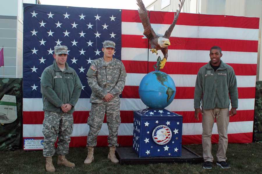 Pvt. Ryan Graf, Johnathon Rife and Alexander Jordan pose for a picture after their welcome home ceremony. The three soldiers were honored by their community after being away at Basic Combat Training in Fort Benning, Georgia. 