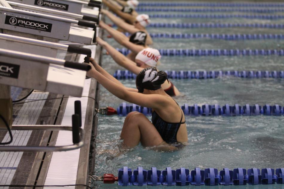 Ashley Castillo (10) anxiously waits for the buzzer to start the race. Munster held the lead through the duration of the meet.