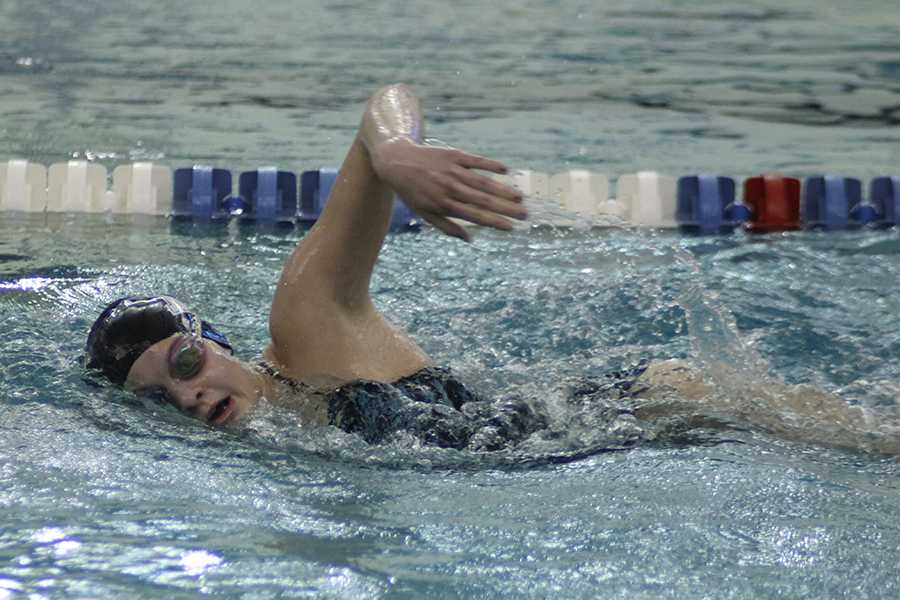 Regan Ingram (9) competes in the 100-yard freestyle. It was Ingram’s best recorded time in the event  this season.