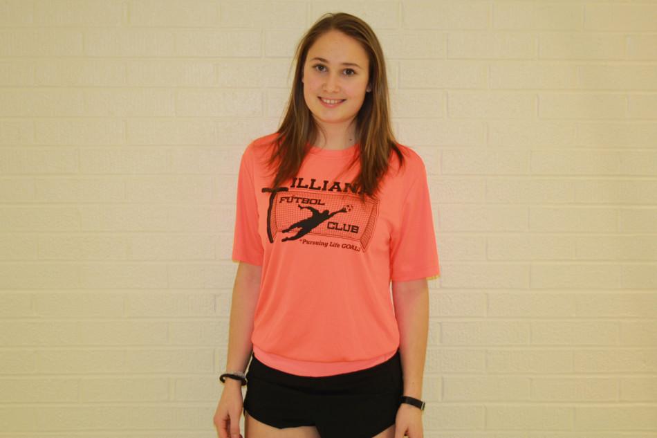 Eléna Kostner (11) smiles for the camera after her interview. This picture was taken before her track practice.