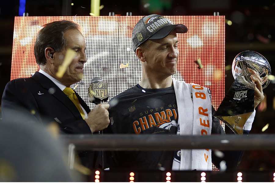 Denver Broncos starting quarterback Peyton Manning, right, holds the Lombardi Trophy after the Broncos 24-10 win against the Carolina Panthers in Super Bowl 50 at Levis Stadium in Santa Clara, Calif., on Sunday, Feb. 7, 2016. The Broncos won, 24-10. (Used with limited license: Nhat V. Meyer/Bay Area News Group/TNS)
