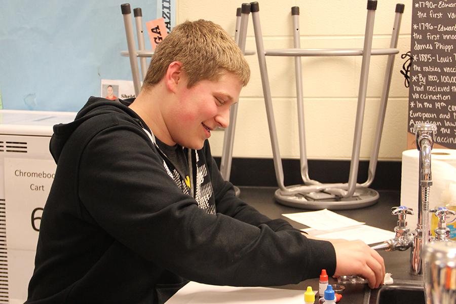 Thomas Pavell (9) sets up his lab experiment for his group. The next Science Club meeting  will be held outside on April 14.
