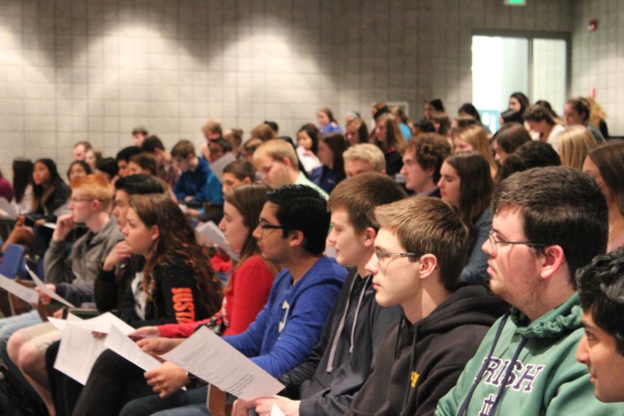 Students listen to those running for office positions in National Honor Society give speeches. People ran for president, vice president, treasurer and secretary. 