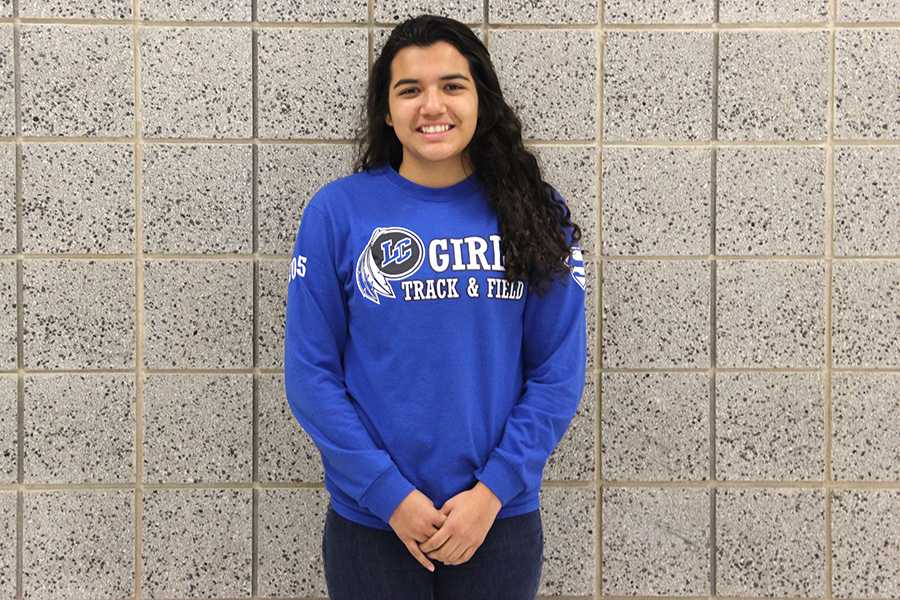 Jasmine Reyes (10) sports a track and field shirt.  Reyes is currently on the girls track and field team.